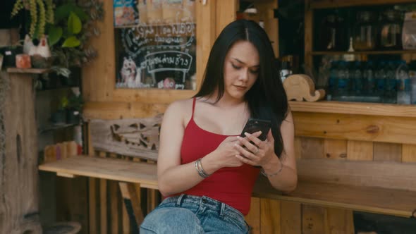 a Beautiful Trans Woman Chatting While Sitting in Cafe