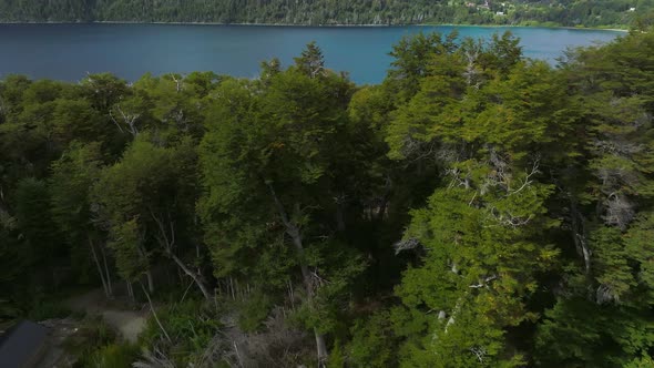 Flying Over Mountain Lake, Patagonia, Argentina, South America. 4K resolution. Beautiful lake as a t