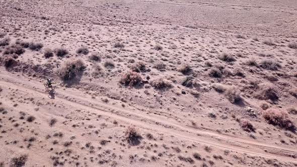 A Group of Cyclists Ride on the Steppe.