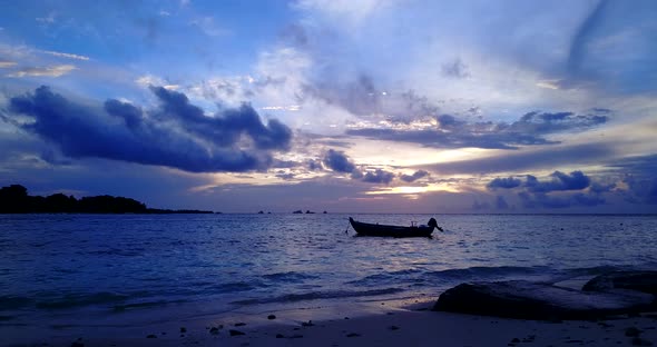 Daytime flying island view of a summer white paradise sand beach and blue sea background in colourfu