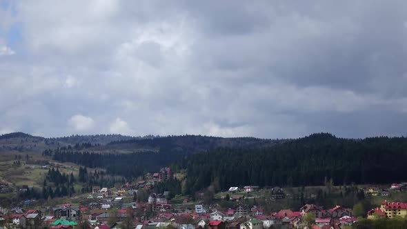 Rolling Clouds Over with Forest Villages on Layers of Hills