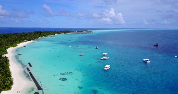 Wide aerial clean view of a white paradise beach and aqua blue ocean background in high resolution 4