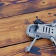 Crashed Drone on the Old Wooden Background with a Broken Camera - VideoHive Item for Sale