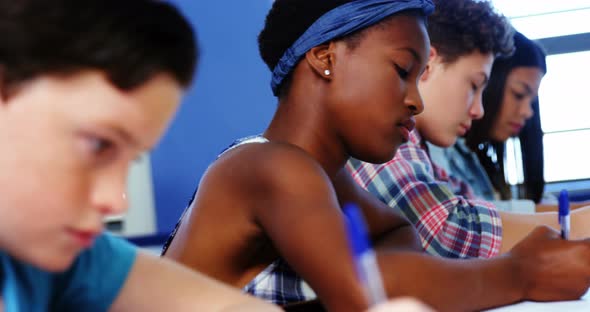 Students studying in classroom