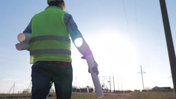 Architect Electrical Engineer Goes with Documents to Objects