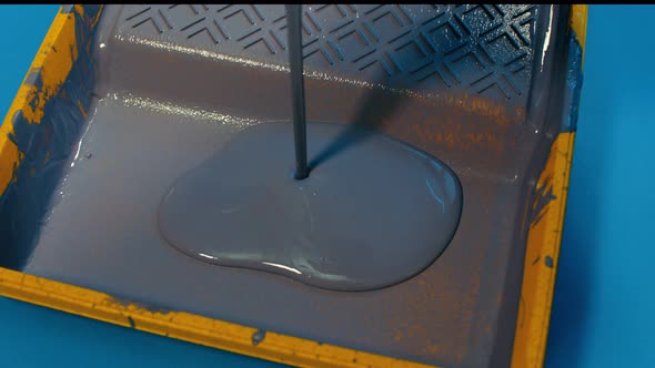 Close Up of Gray Paint Pouring in Plastic Tray