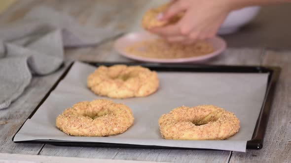 Woman Hands Cooking a Turkish Bagels Simit