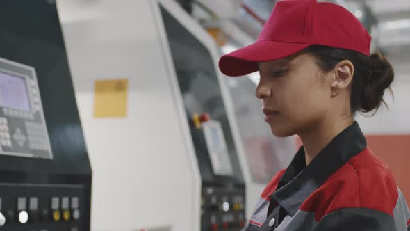 Mixed Race Woman Working At Factory