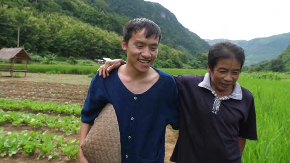 Young Farmer Walking With His Father