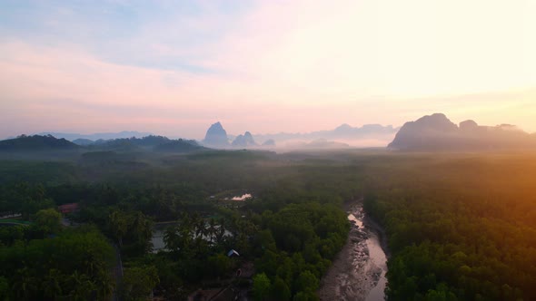 4K : Drone flying above the clouds, Limestone mountains with mangrove