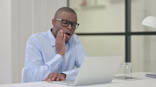 African Man Having Toothache While Drinking Water