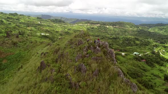Aerial view of peak Chocolate hills and cloudy sky in Badian, Philippines.