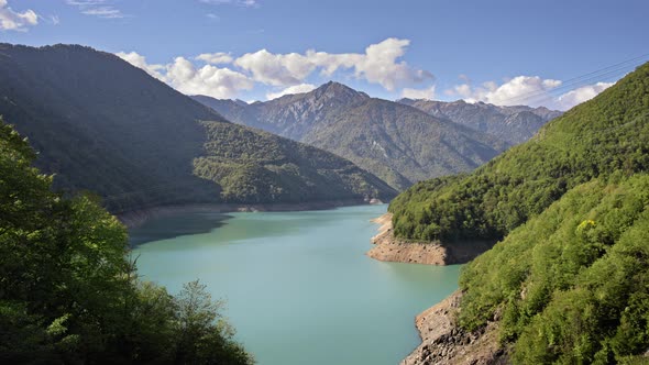 Time lapse of blue lake and mountains