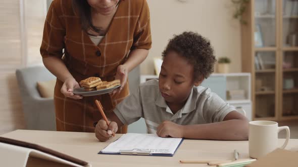 Mom Bringing Waffles to Student Son