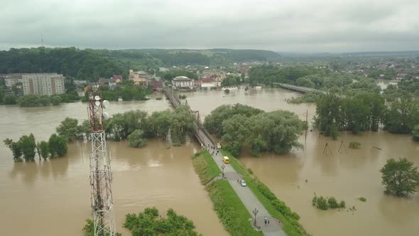 Natural Disasters. Destructive Flood After Torrential Rains. Top View of Flooded City, Cars and