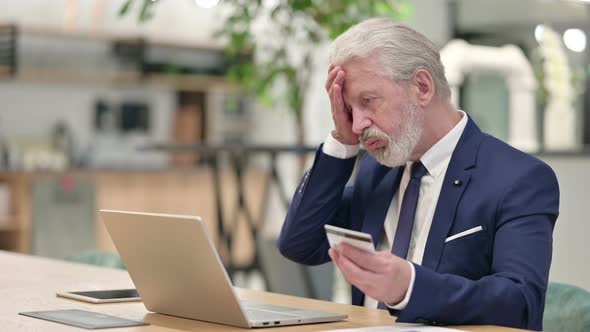 Old Businessman Having Online Payment Failure on Laptop