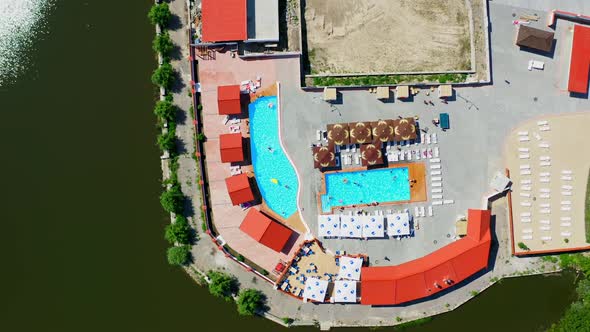 Aerial drone bird eye view of pool resort