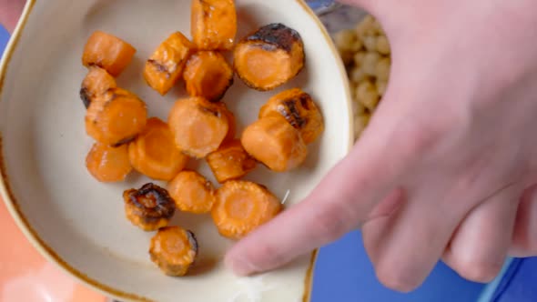 Vertical Flat Lay Video Cooking Humus Chef Adds Fried Carrot to the Nutt in the Blender Bowl Making