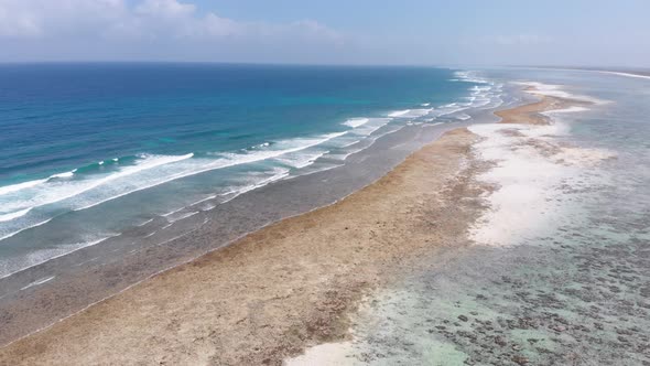 Ocean Coastline and Barrier Reef at Low Tide Zanzibar Matemwe Aerial View