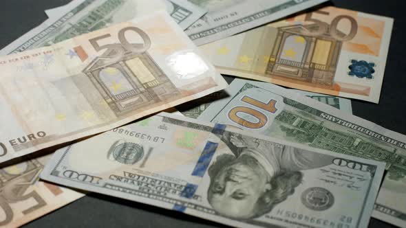 Dollars and Euros Are Falling on the Table
