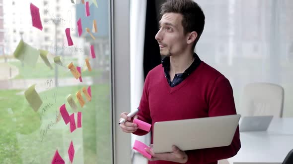 Serious Confident Professional Using Laptop