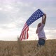 Happy Patriotic Young Woman Waves the US Flag and Jumps Into the Field - VideoHive Item for Sale