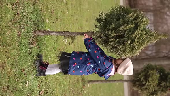 Little Girl Walking Outdoors in the Park During Qurantine