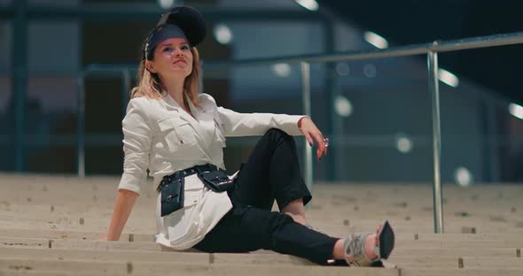 Stylish Model Relaxing on Stairs