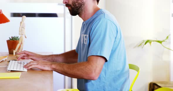 Male volunteer working on computer