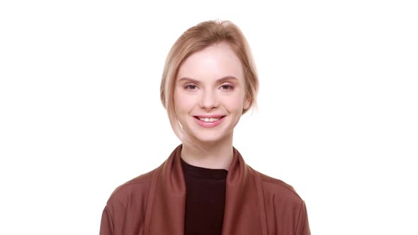 Beautiful Young Caucasian Teenager Girl Standing on White Background Smiling Looking at Camera in