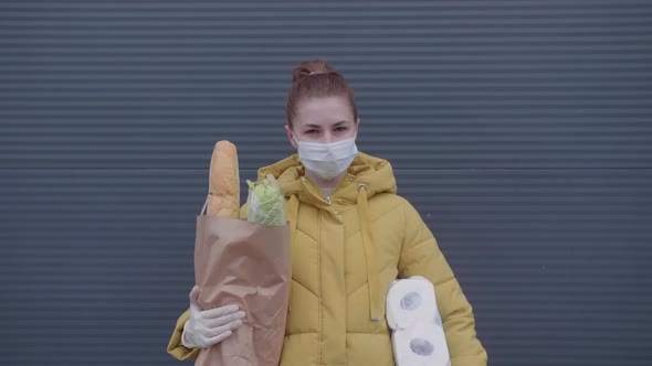 Young Woman with Purchases From the Supermarket