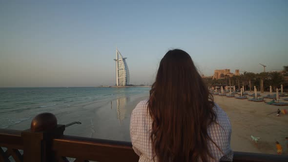 Woman Enjoying the View of Burj Al Arab Hotel in Dubai