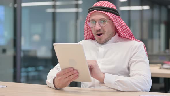 Successful Middle Aged Arab Man Celebrating on Tablet