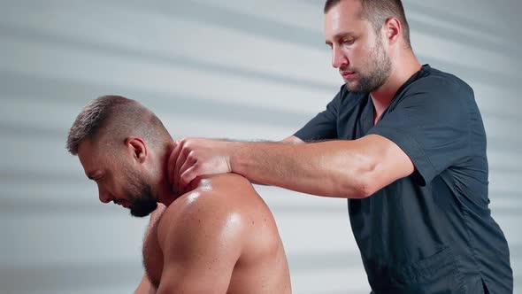 Sports Massage. Man Has Deep Tissue Massage on the Back