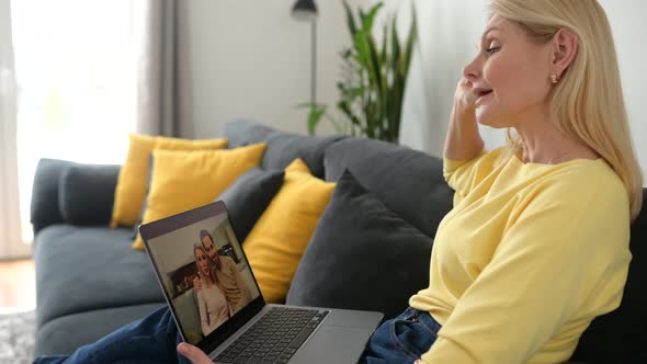 Back View a Senior Woman Using a Laptop for Video Call