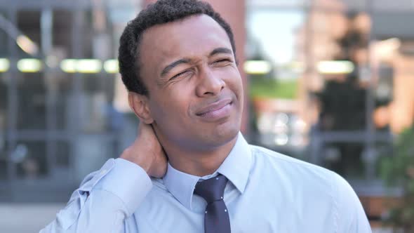 Tired African Businessman with Neck Pain