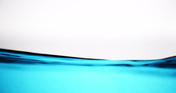 Blue Water Surface In Motion Against White Background