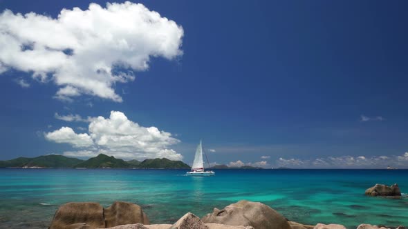 Catamaran Sailing Between Islands