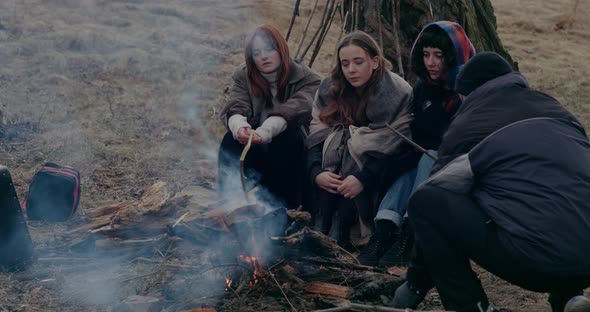 Refugees Warming At Bonfire During War Crisis