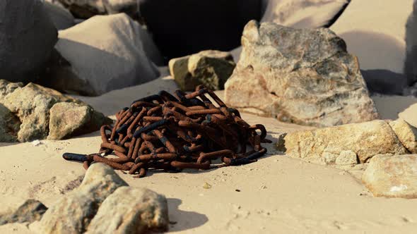 Old Rusted Chain in the Sand