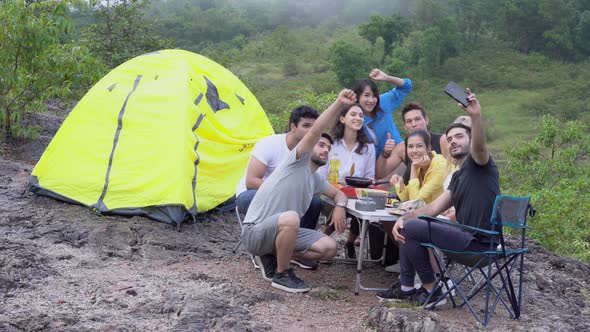 Happy group of friends taking a photo backpack to travel adventure in summer.