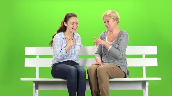 Mom and Daughter Laugh. Green Screen