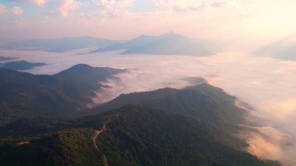 4K Aerial video, The sun's rays over mist in the morning