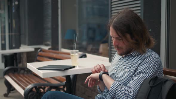 Man with Smartwatch Using Voice Recorder Recognition Audio Message Command Outside on Street