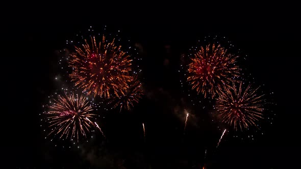 Colorful real fireworks display celebration in New year's eve with an abstract blur of golden shinin