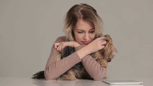 Woman with dog suffering from stress