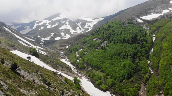 Piece of Snow on the Mountain Slope and Valley