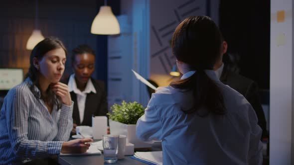 Multi Ethnic Managers Teamwork Checking Financial Graphs Analyzing Business Paperwork