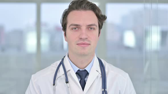 Portrait of Young Doctor Looking at the Camera