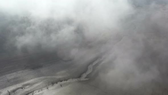 Flight Over A Dry Dam In The Autumn Foggy Day In The Morning